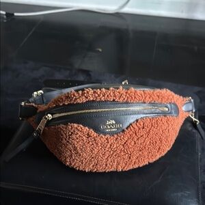 Coach Tan and Black Crossbody Bag with Sleek Design